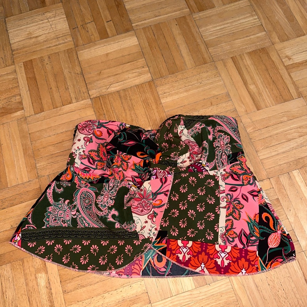 Pink and black patchwork strapless top with grip.